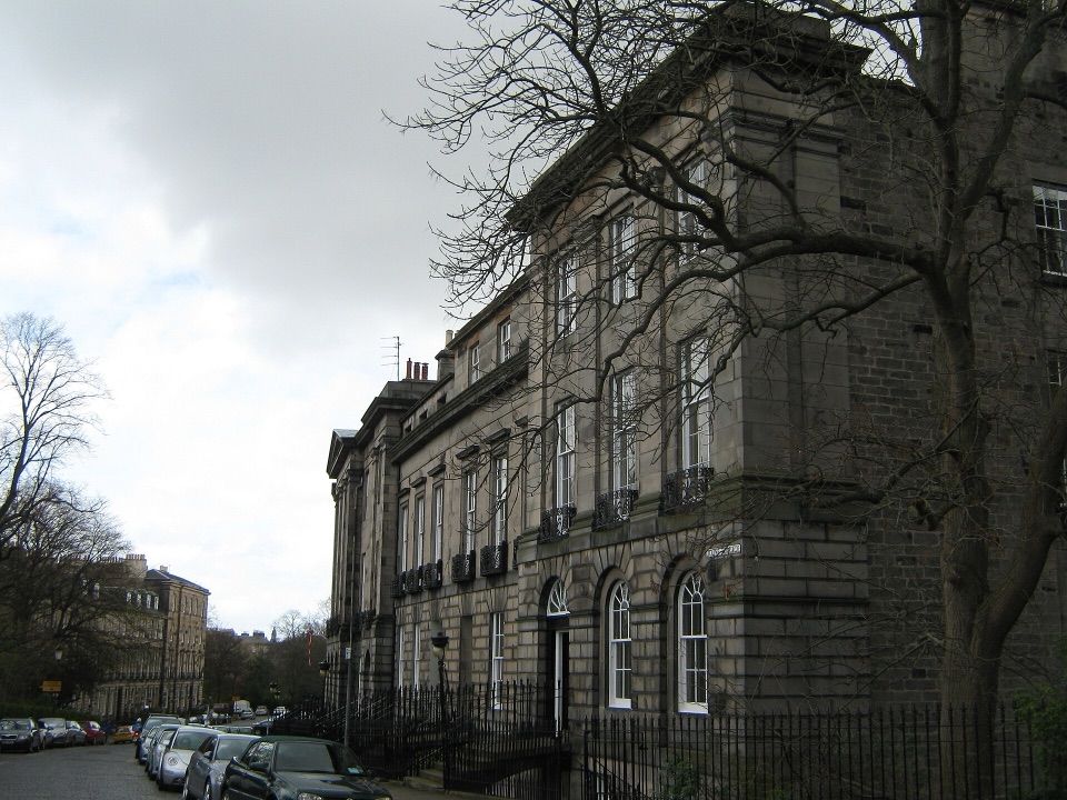 The end of a Georgian stone terrace in Edinburgh seen from the street